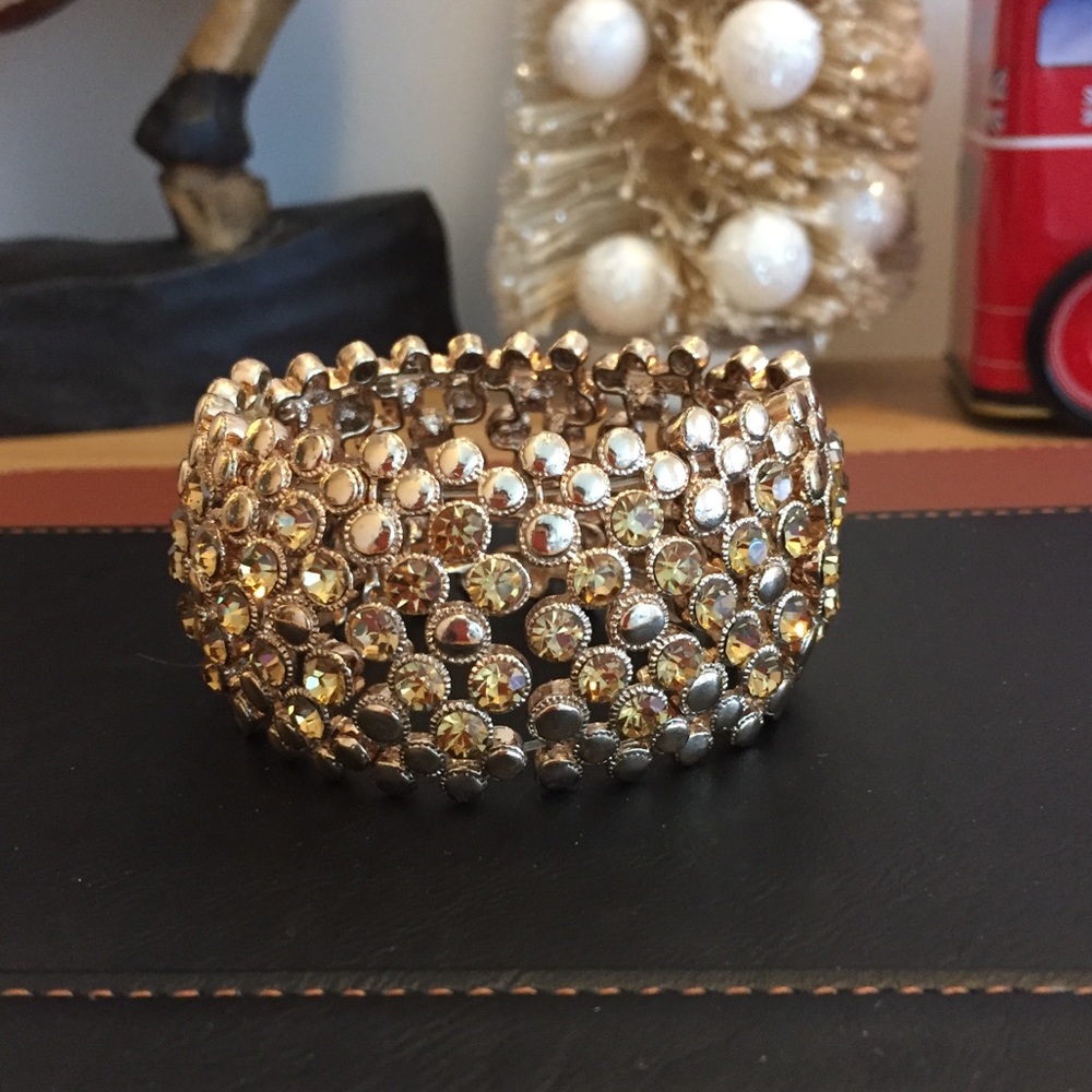 Gold tone cuff bracelet.